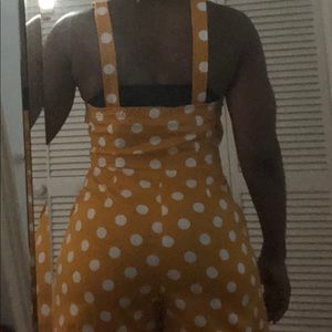 This is a cute golden/mustard romper.